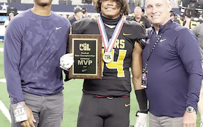 Named Most Valueable Player for the Bears defense is #14 Tyler Lane being presented the UIL award in Arlington, Texas. Talor Bragg | The Light and Champion