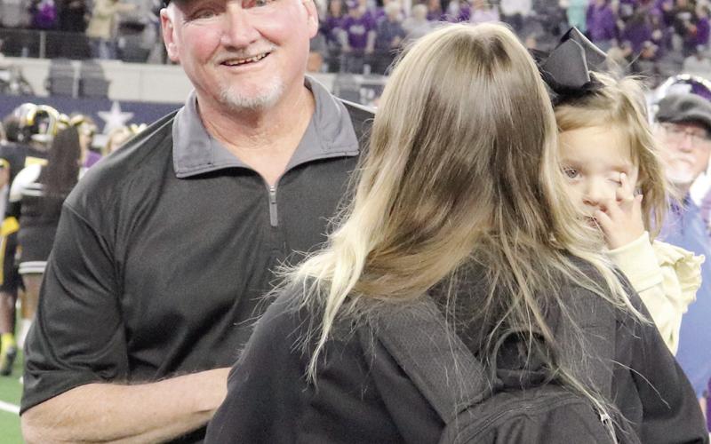 Timpson Head Coach Kerry Therwhanger with his Daughter-in-law and granddaughter after the final whistle blew on the Timpson Bears first state championship win. Taylor Bragg | The Light and Champion