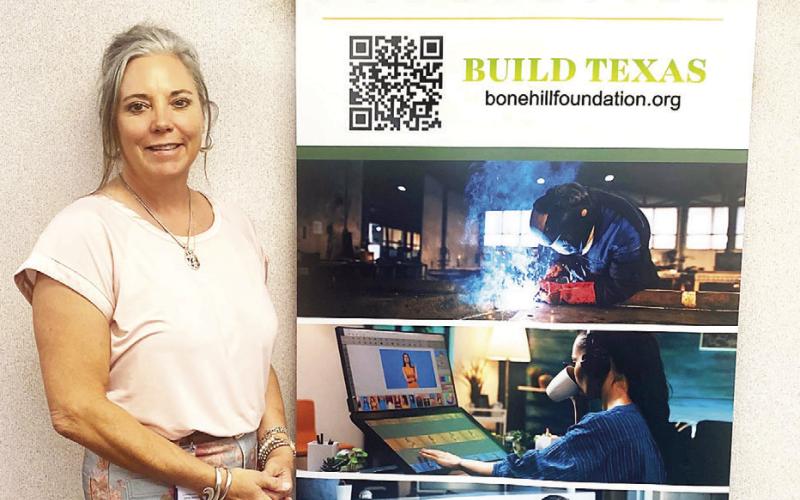 Jennifer Wyatt of Portacool displays a BUILD TEXAS banner as part of the kickoff to the Bone Hill Foundation’s vocational education awareness initiative Submitted | Light and Champion