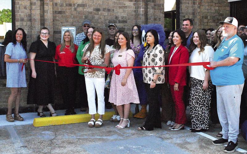 The Timpson branch of BOM banks celebrated its grand re-opening celebration April 10 after its recent re-modeling with a ribbon cutting sponsored by the Timpson Area Chamber of Commerce. Lisa White | Light and Champion