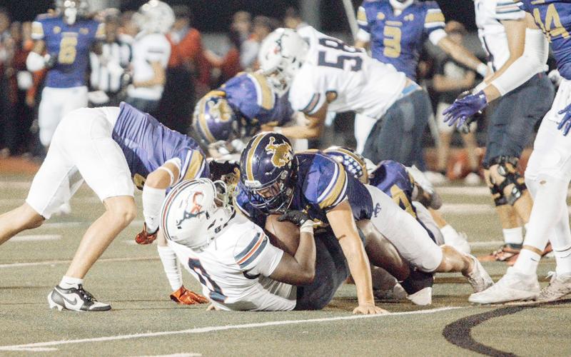 Roughrider defense sticking a tackle and pinning the Mustangs. Lainee Cooper | Light and Champion