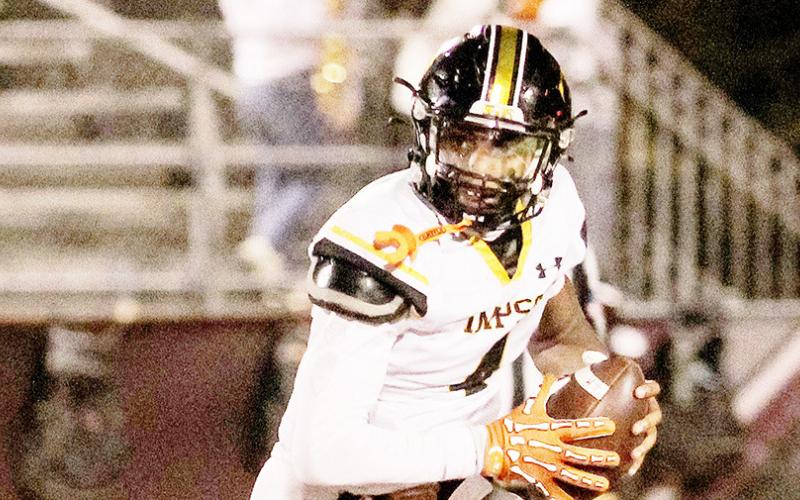 Timpson’s Albert Parker, Jr., rolls out looking for an open receiver in the Bears’ game against San Augustine Wolves last Friday night. Despite a valiant effort, the Bears fell to the Wolves by a score of 30-14. Savannah Cassell | Timpson ISD Student Media Intern