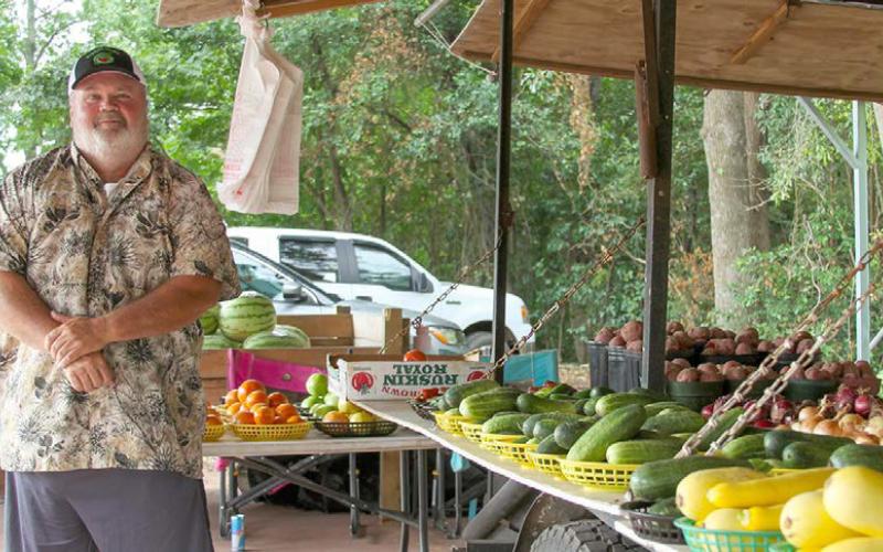 Mr. Johnson next to his Produce Stand on Tenaha Street. Leon Aldridge | Light and Champion