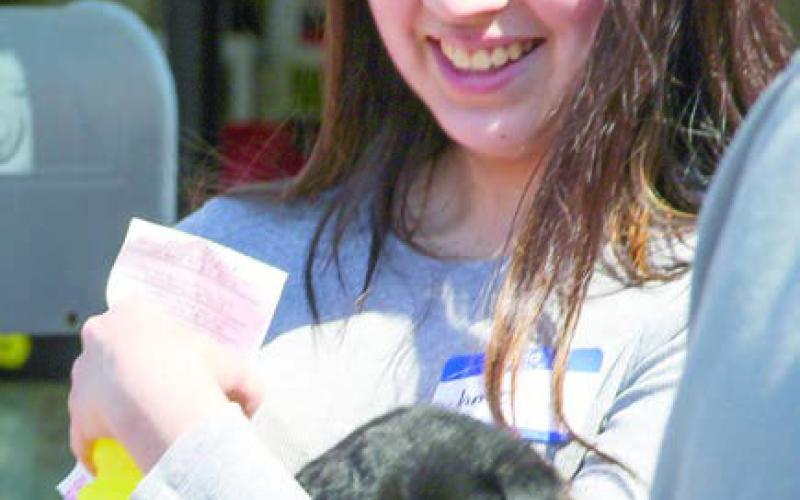 The Happy Tails Adoption Agency’s event at Tractor Supply in Center had many attendees were etting acquainted with animals in hopes of providing them with new homes.