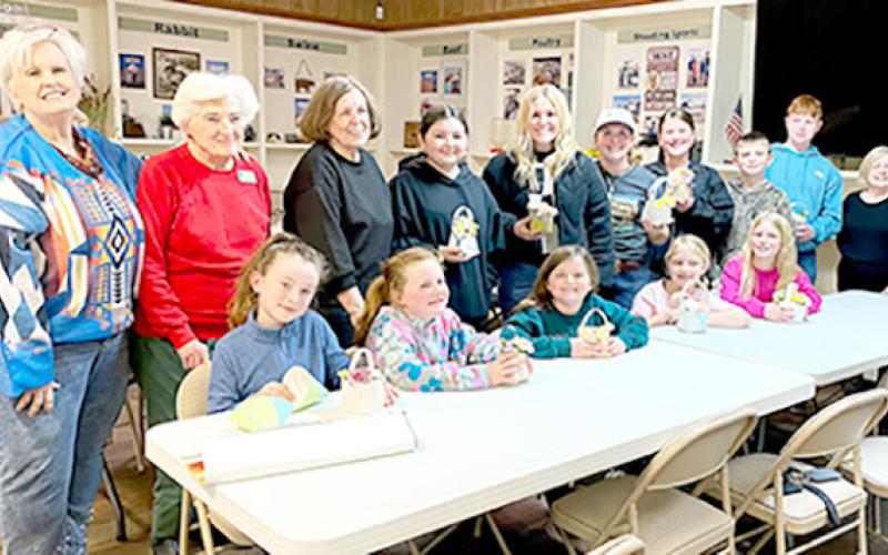 Center Garden Club members take the time to instruct 4H members in basket making. Submitted | Light and Champion