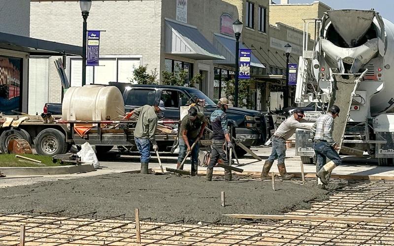 Austin Street reconstruction was drawing closer to completion Tuesday as pouring concrete resumed. Frequent rain in the last two weeks had halted progress. The reconstruction replacing asphalt with concrete is aimed at correcting a drainage issue. See tomorrow’s edition of The Light and Champion for coverage of this week’s Center City Council.