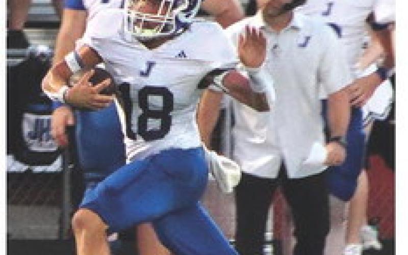 u Justyn Brown prepares for a collision with a Shelbyville defender during their district opener last Friday. (Photo by Taylor Bragg)