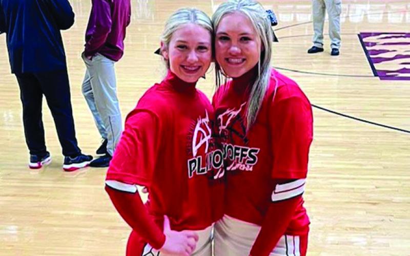 Taylor and Carsey, a pair of Dragon Cheerleaders are all smiles after the game win over Timpson.