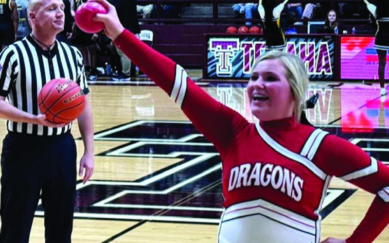 Camille has a little cheer for the crowd as she readies the audience for a few keepsake mini-basketballs.