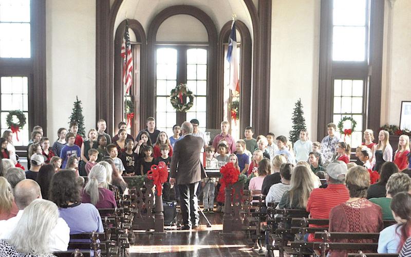 The Shelby County Historic Courthouse’s open house was brightened up by a musical performance from the Excelsior ISD Choir. Zack Clark | Light and Champion