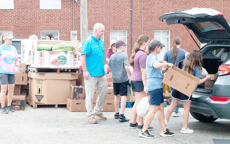 Helpful church volunteers were seen distributing food at the Center First Baptist Church parking lot on Friday, Aug. 22, during their monthly produce drop with the East Texas Food Bank. The church and its volunteers help distribute the Food Bank produce every fourth Friday of the month from 4 to 5:30 p.m. If you are interested, be sure to mark your calendars and stop by the First Baptist Church in Center next month on Friday, Sept. 26. Zack Clark | Light and Champion