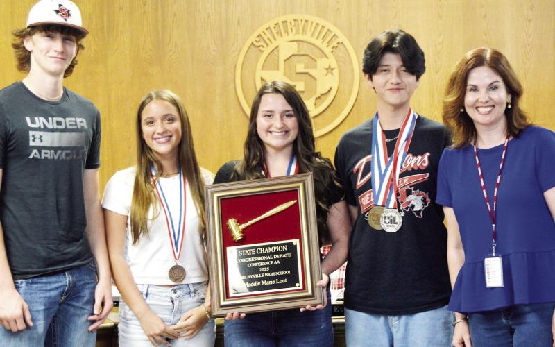 Several Shelbyville High School students were recognized at this month’s school board meeting for their accomplishments in debate competition. They were (left to right) Gaylon Harrison, Kennedy McArthur, Maddie Lout (state champion in Congress) and Travis Caporali. With them is their debate and speech coach, Emily Sowell. David Danley | Light and Champion