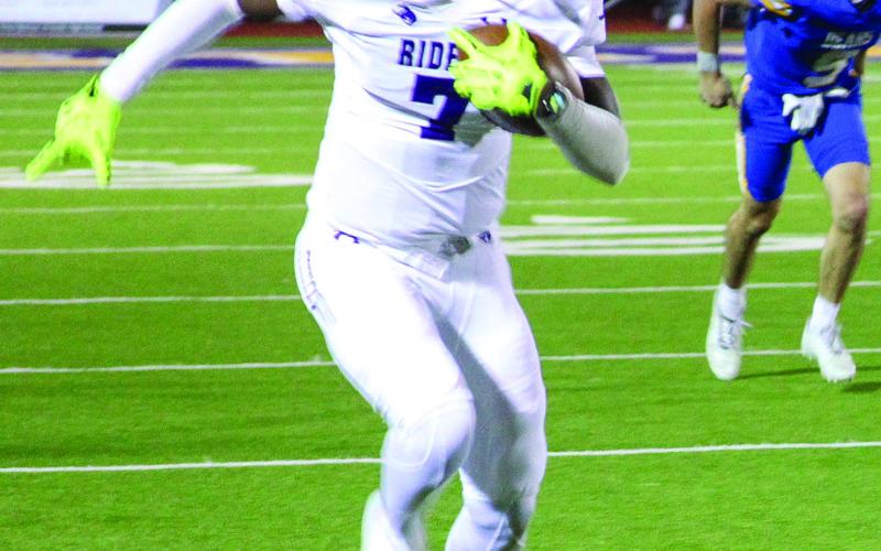 p Travis Belin charges down the sideline outpacing Brownsboro Bear defenders. (Leon Aldridge photo/The Light and Champion)
