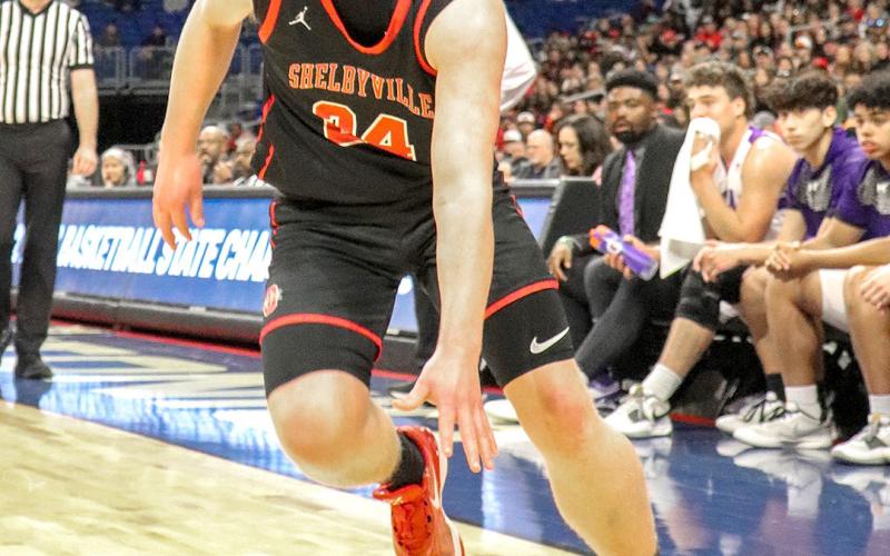 Eli Furgeson moves the ball down court to the Thrall Tigers goal looking for an open teammate for two.