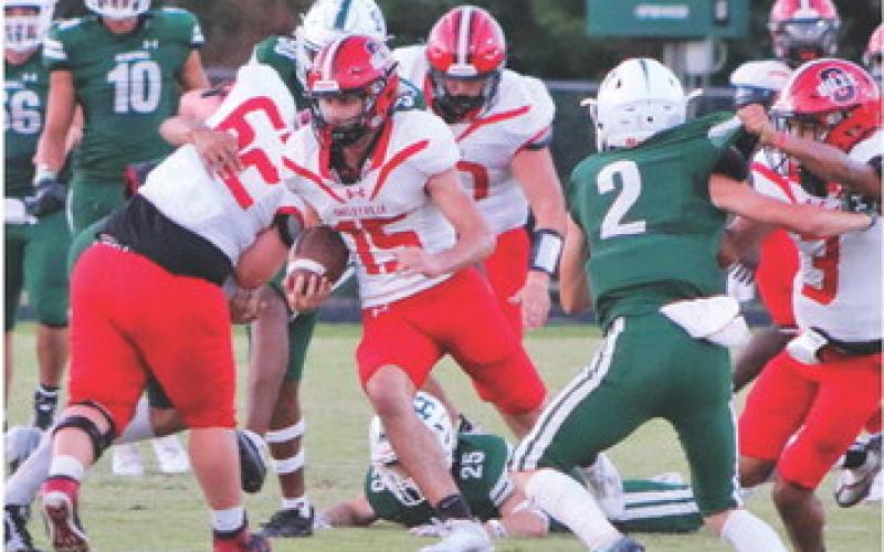After catching a screen pass, Dylan Parker finds a seam in the Hemphill defense. (Photo by Taylor Bragg)