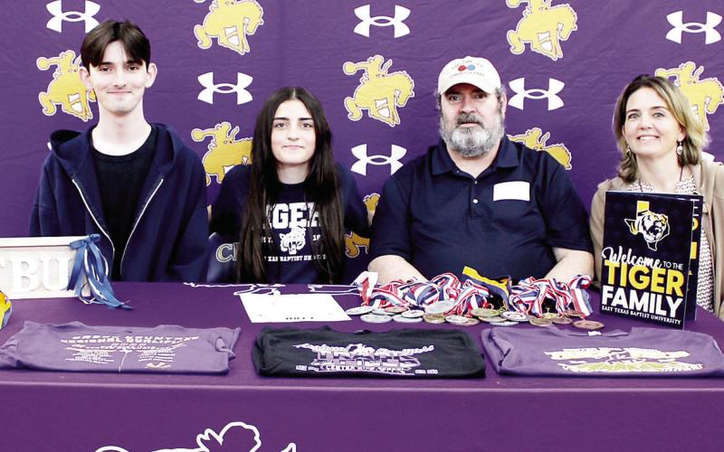 Center High School student Rachel Newton has signed with East Texas Baptist University to continue her track and cross country career. With Rachel at her signing ceremony were her parents, David and Rebecca Newton, and her twin brother, Nathan Newton. Rachel was coached by Coach Smith and Coach Garcia. Submitted | Light and Champion
