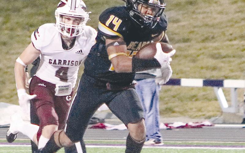 #14 Tyler Lane heads to the end zone against Garrison, just one stop on the road to the big show. Taylor Bragg | The Light and Champion