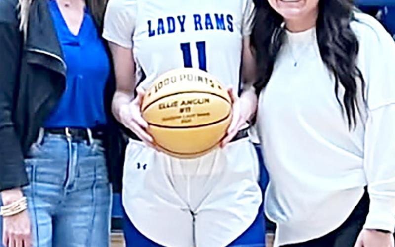 Joaquin senior Ellie Anglin has surpassed 1,000 points in her career. With Anglin are her coaches Mindy Bragg (left) and Katelyn Martinez Harris. Submitted | Light and Champion