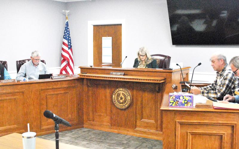 The Shelby County Commissioners Court studies the monthly bills presented to them at their regular meeting held on Wednesday, March 28. Lisa White | Light and Champion