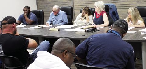 Timpson city mayor Debra Smith (center) leads discussion on the best method of cleaning up debris in city parks and right of ways. The council also considered raising the rental rates for its community building. Lisa White | Light and Champion
