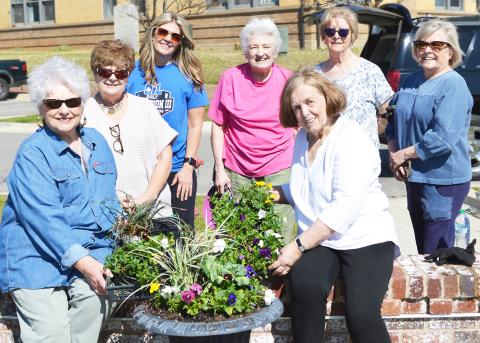 Members of the Center Garden Club made the rounds of the Center square recently updating the planters with a selection of spring flowers. Joining in on the project were (seated, left to right) Vicky Warren and Carolyn Bounds and (standing, left to right) Jennifer Wulf, Jennifer Whittlesey, Jeanette Wittmann, Lavonne Wood and Cherry Jones. David Danley | Light and Champion