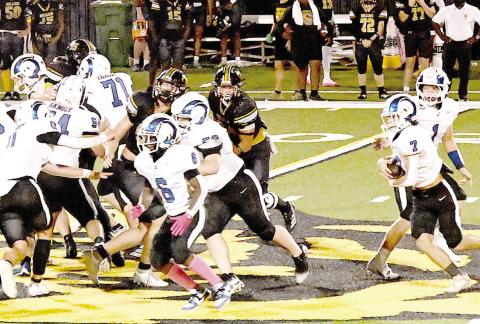 The Joaquin Rams’ Zach Kelley (7) takes a handoff from quarterback Trenton Runnels (1) while Amarion Wilson (6) leads the way upfield in action against the Timpson Bears last week. Kelsi Wood | JHS