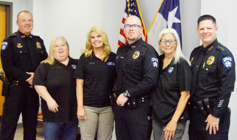 Members of the Center Police Department gathered this past Friday to witness the promotion of three long-term dispatchers and a patrol officer. (Left to right) Lieutenant Andy Williams, Amy Lindley, Donna Dugger, Detective Garret Rocchi, Charlene Jackson, and Chief Ricky King. Zack Clark | Light and Champion