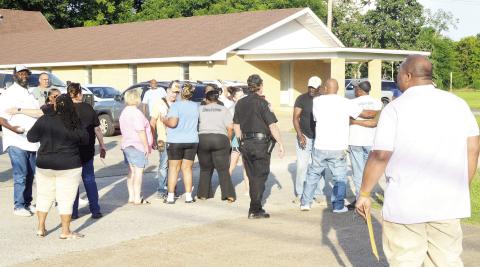 Tenaha Mayor O’Neal Jones (right) was confronted by angry residents after a Tenaha city council meeting Monday evening which saw Police Chief Jake Metcalf dismissed from his position. David Danley | Light and Champion