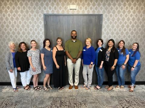 Shelby County Children's Advocacy Center staff smile for a photo with guest speaker Gaelin Elmore after Tuesday's presentation. (Submitted photo) 