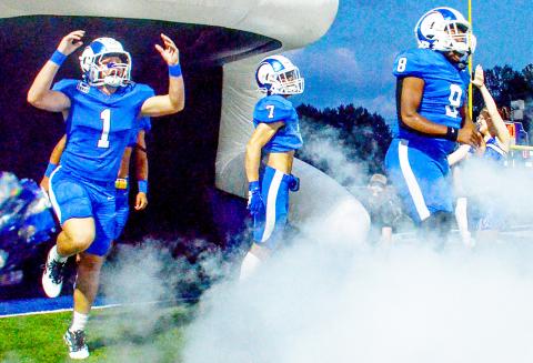 The Joaquin Rams burst out of the tunnel ready to rumble before their game against the Grand Saline Indians. Kelsi Wood | JHS
