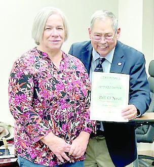 Kathy Grisby presents a certificate of appreciation to Bill O’Neal for his presentation on Audie Murphy at the Timpson Area Genealogical and Historiacl Society March meeting. Submitted | Light and Champion