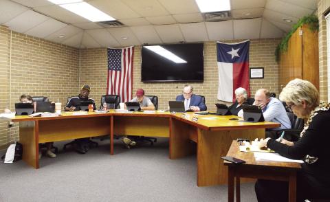 The Timpson ISD board of trustees reviews the monthly nancial report at its April meeting. David Danley | Light and Champion