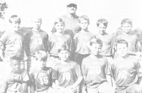 Members of the Center 49s Division I Flag Football team are (front, left) Allen Collins, Dustin Taylor, Collin McElroy, Coy Campbell and Shelby Stennett; (back, left) Matt Foster, Nickolas Friant, Jeremy Smith, Randall Pritchett, Michael Titman and Daniel Emanis; coach is Randy Clark. Not pictured are Doug Eaves, Ronald Roden and coaches Mike Walker and Joe Jackson.