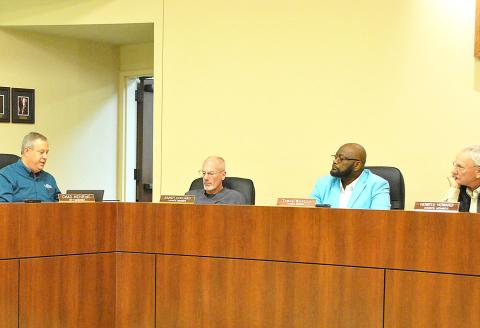 Center City Manager Chad Nehring informs the city council about bids received to replace the roofs on the city hall and library buildings. Lisa White | Light and Champion