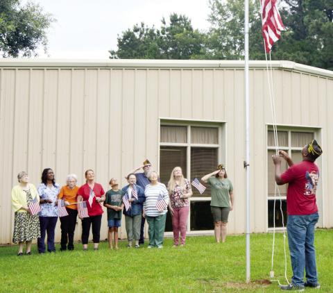 Members of VFW Post 8904 visited the Shelby County Outreach Ministries Senior Nutrition Site on Friday to donate a new flag in observance of Flag Day. Flag Day was established to commemorate the adoption of the American flag by the Second Continental Congress in 1777. David Danley | Light and Champion