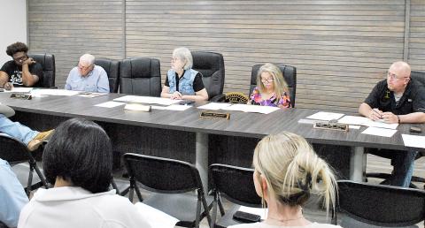 Mayor Debra Smith (center), leads the Timpson city council in a discussion on debris cleanup options in the wake of winter storm Fern. Lisa White | Light and Champion