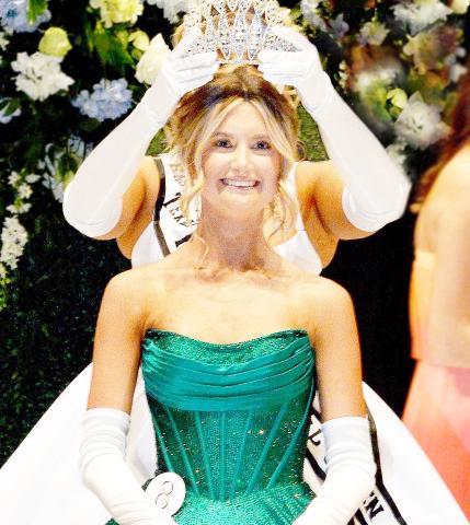 Payton McGee is crowned the 2025 East Texas Poultry Festival Queen by 2024 Queen Lillian Chisenhall during the coronation ceremony held last Saturday evening in the CHS cafetorium. Look for a Light and Champion special section on Thursday, Oct. 16 for complete coverage of the festival with more pictures of the pageant and other activities. David Danley | Light and Champion