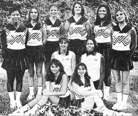 The 1997-98 Tenaha Varsity Cheerleaders and Mascots are (from left, standing) Chiniqua Caraway, Andrean Robinson, Christy Holmes, Jamie Conway, Katrina and Robin; (kneeling, left to right) Tara Sims and Tammie Williams; (sitting) Crystal Praish and Tammy Carwood.