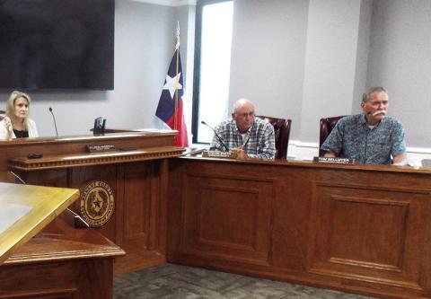 Commissioners Stevie Smith and Tom Bellmyer listen to a report from Sheriff Gerald Corbell concerning his department’s recent visit to the state Jail Commission. Zack Clark | Light and Champion