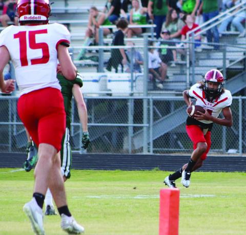 Junior Geechi Mathis takes a reception to the house in action earlier this season. Friday Mathis made the most of his one reception by taking it 23 yards and crossing the goal line. (Photo by Taylor Bragg)