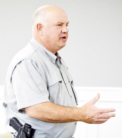 Chief Deputy Mike Hanson addresses the Shelby County commissioners court concerning the hiring of a new reserve deputy for the sheriff’s office. Zack Clark | Light and Champion