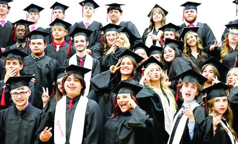 Shelbyville High School graduates express their exuberance at finally reaching a milestone in their young lives while looking forward to what lies ahead for them. See the back page for more pictures of area graduation ceremonies. Submitted | Light and Champion