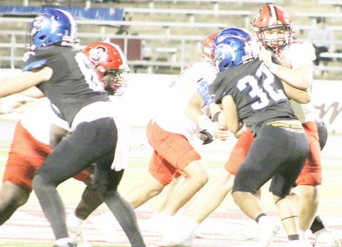 Members of Shelbyville’s offensive line struggle with Leon’s defensive front in an effort to control the line of scrimmage. Dragon Yearbook | Light and Champion