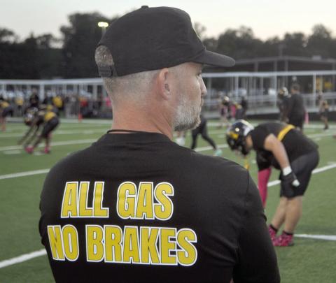 Words to live by printed boldly on the back of the Timpson Bears coaching t-shirts. Picture during warmups for las weeks meeting of Timpson vs. Hemphill. The final, Timpson 35, Hemphill 22. Dennis Phillips | Light and Champion