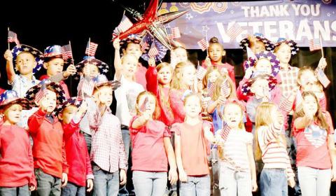 Second grade students from Shelbyville ISD’s S.W. Carter Elementary School perform during the Veteran’s Day program the school held to honor area veterans Tuesday, Nov. 11. Submitted | Light and Champion