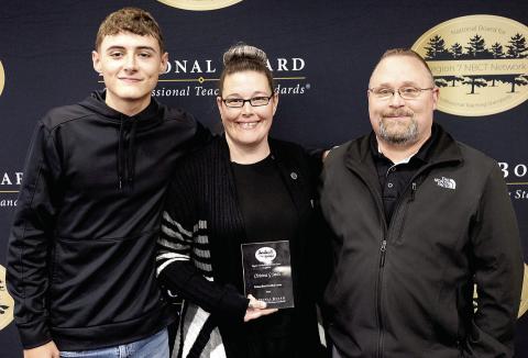 Christina Smith with her husband, Chris Smith, and their son, Ayden Smith, after being recognized as a National Board Certified Teacher. Submitted | Light and Champion
