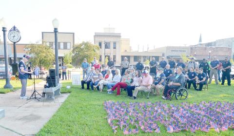 Larry Hume, VFW Post 8904 Adjutant, addresses the gathered crowd at the memorial ceremony held in honor of Patriot Day. During the ceremony, first responders and law enforcement personnel spoke in memory and honor of those who have served and died in the line of duty in service to their country. David Danley | Light and Champion