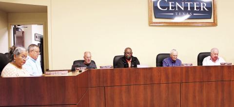 The Center city council reviews the minutes of its previous meeting at its April 27 meeting. Lisa White | Light and Champion