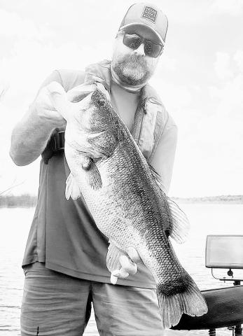 TPWD fisheries biologist Dan Bennett with a solid 9 pounder he caught and released by Bois d’ Arc Lake in Fannin County. Photo courtesy Dan Bennett
