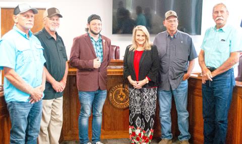 Mark Dickson (center) joins County Judge Allison Harbison and commissioners (from left) Shannon Metcalf, Roscoe McSwain, Stevie Smith and Tom Bellmyer in declaring Shelby County as a Sanctuary County For The Unborn at the July 30 commissioners court meeting. Zack Clark | Light and Champion